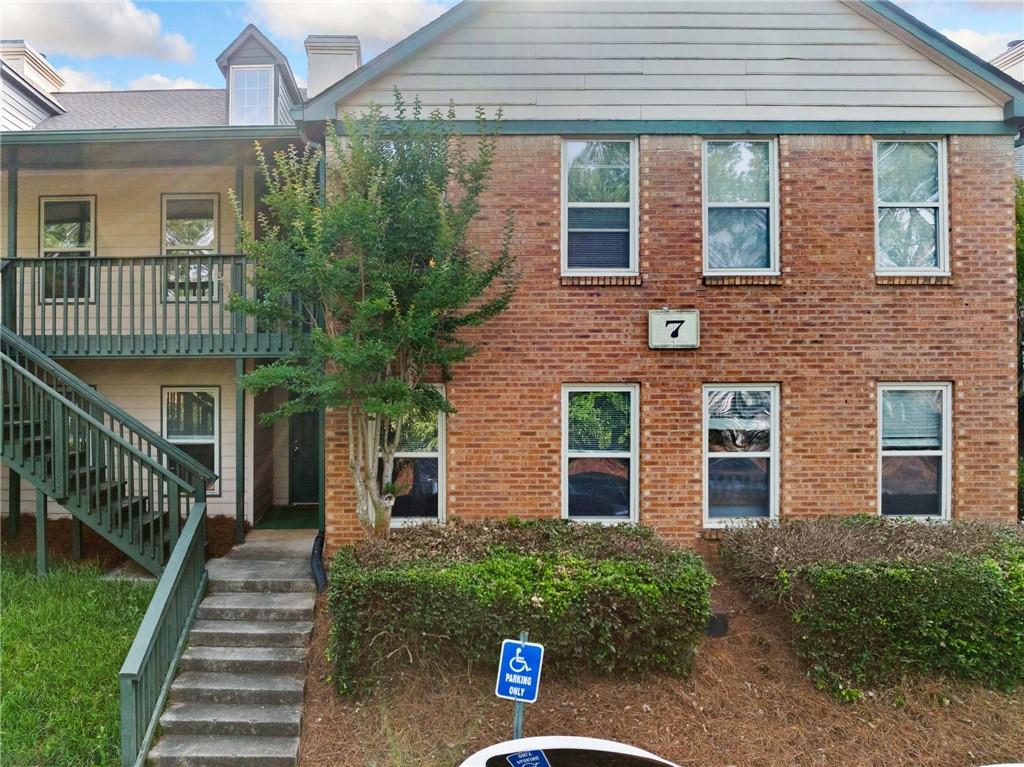 717 Beaufort Circle Duluth, GA 30096 - Photo 26 of 42 a front view of a house with a yard