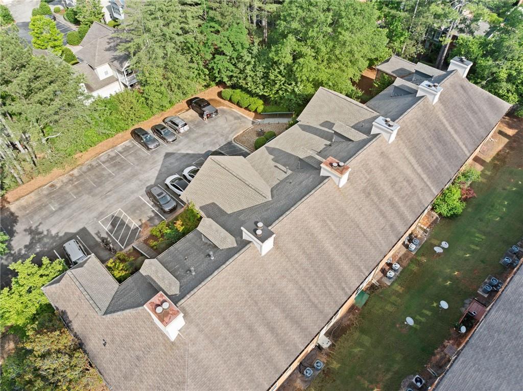 717 Beaufort Circle Duluth, GA 30096 - Photo 33 of 42 an aerial view of a house with a yard and lake view