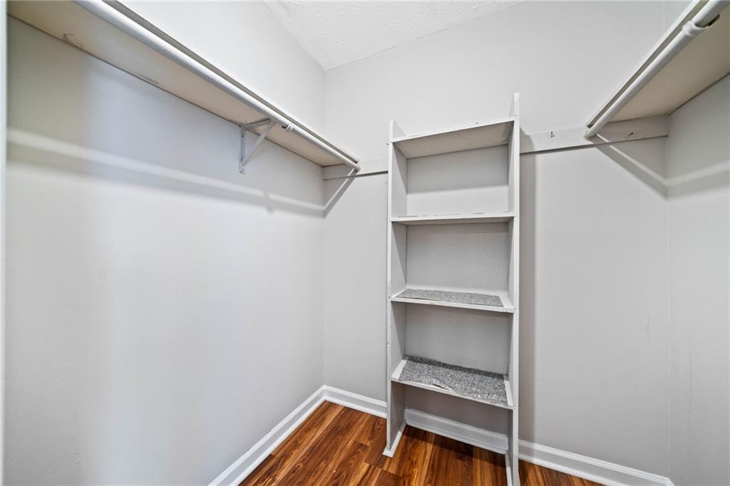 717 Beaufort Circle Duluth, GA 30096 - Photo 9 of 42 a room with rack on the wall