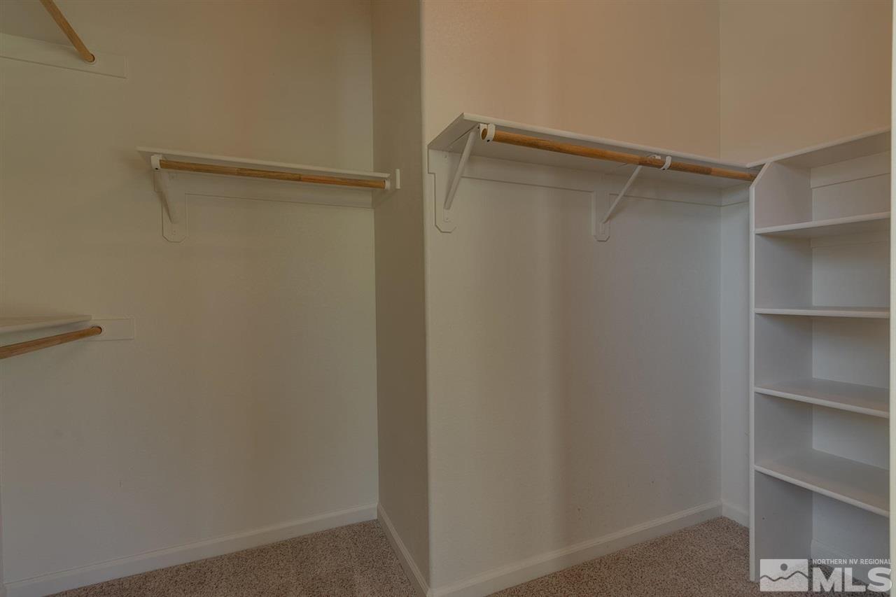 1721 Camaraderie Way Reno, NV 89521 - Photo 14 of 18 a view of walk in closet with empty racks
