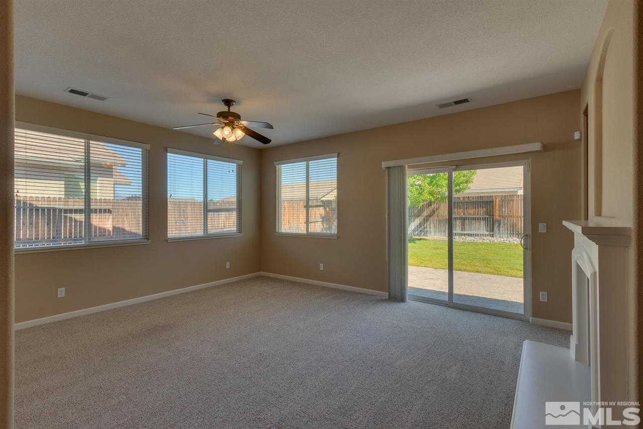 1721 Camaraderie Way Reno, NV 89521 - Photo 6 of 18 a view of an empty room with a window