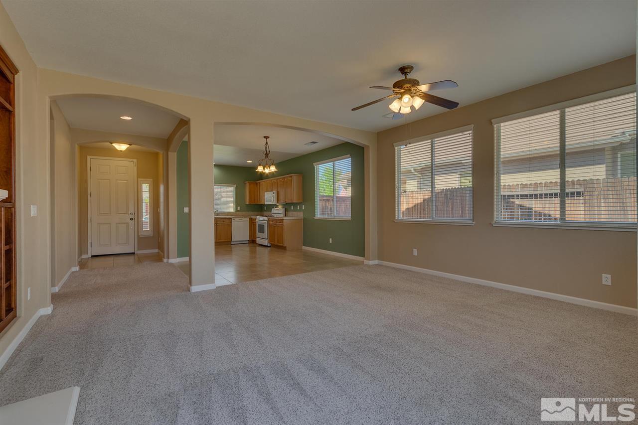 1721 Camaraderie Way Reno, NV 89521 - Photo 8 of 18 a view of a livingroom with a ceiling fan and window