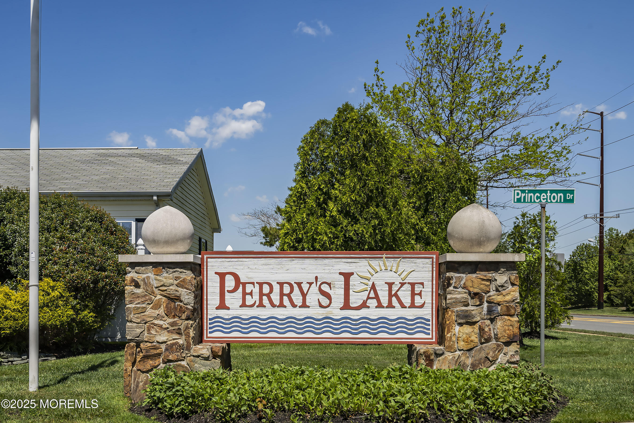 75 Perrys Lane Manahawkin, NJ 08050 - Photo 13 of 18 a view of a street sign under a large tree