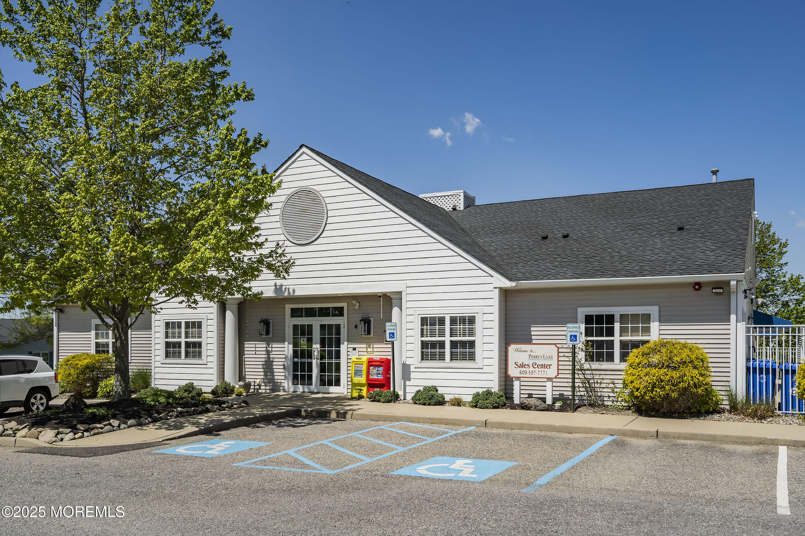 75 Perrys Lane Manahawkin, NJ 08050 - Photo 14 of 18 a front view of a house with a garden