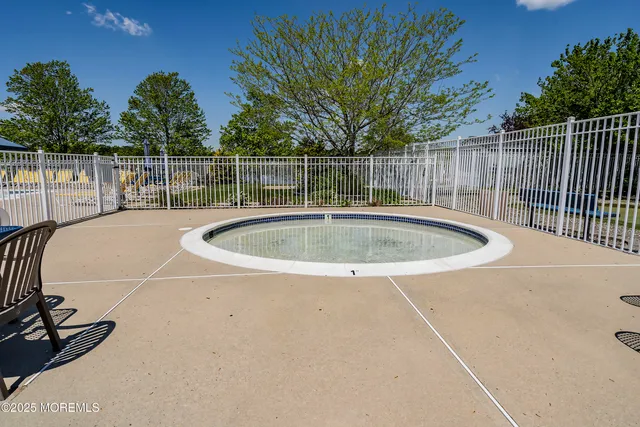 a outdoor space with swimming pool and furniture