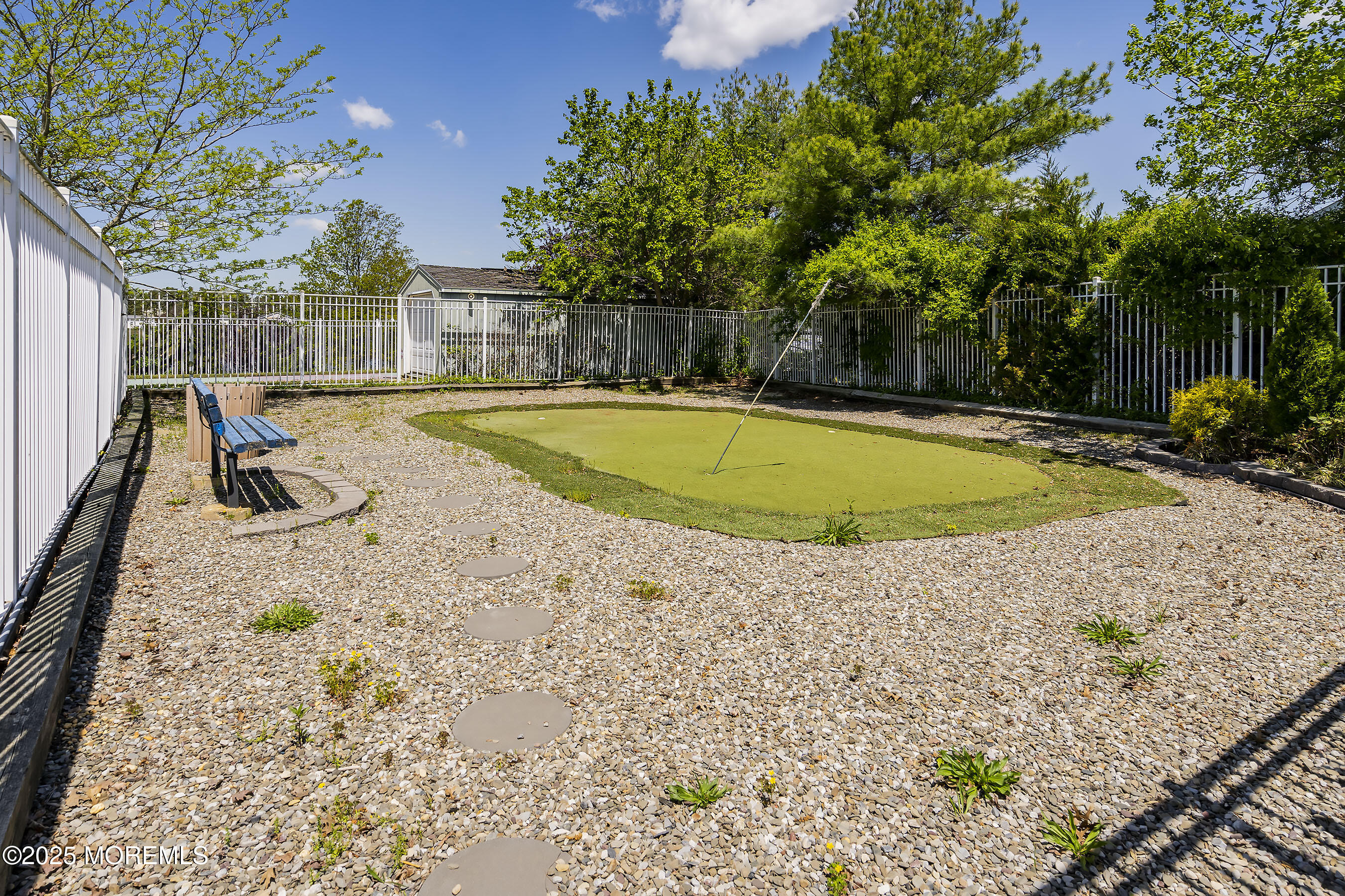 75 Perrys Lane Manahawkin, NJ 08050 - Photo 17 of 18 a view of a swimming pool with a patio and a yard