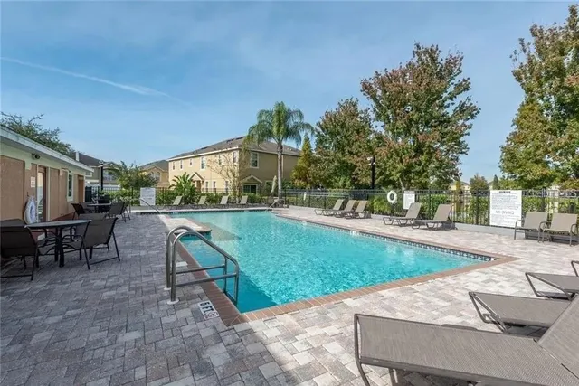a view of a backyard with sitting area