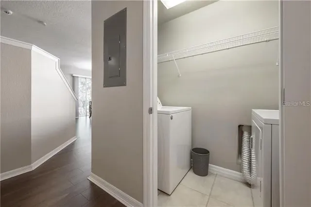 a view of entryway and hallway with wooden floor