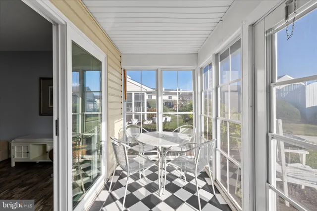 a room with furniture and large windows