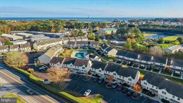 an aerial view of a house with a ocean view