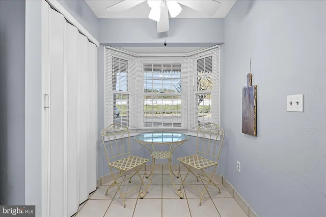 a dining room with furniture and window