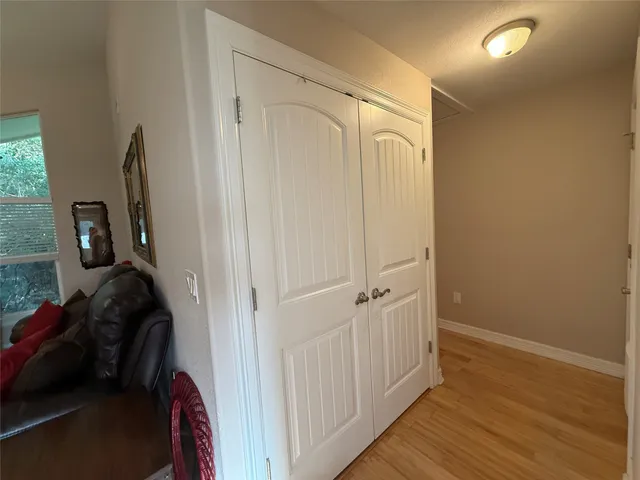 a view of a closet area with living room