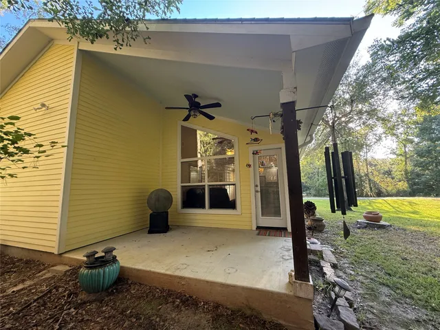 a view of a porch with potted plants