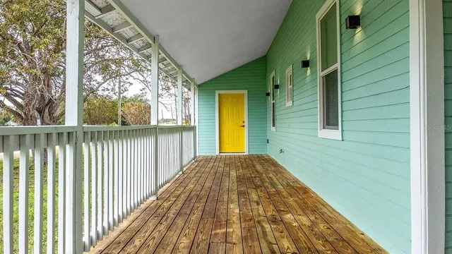 a view of a brick house with a large window