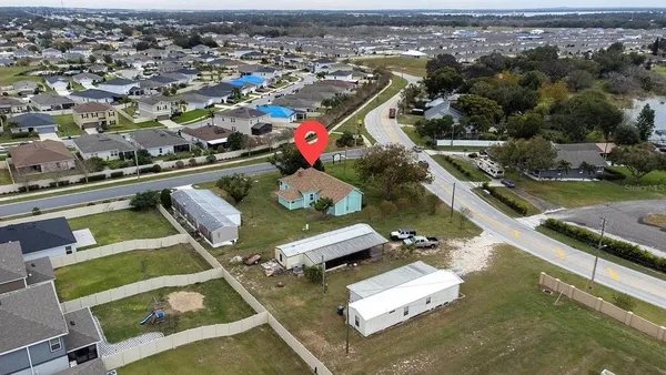 an aerial view of a house with a ocean view