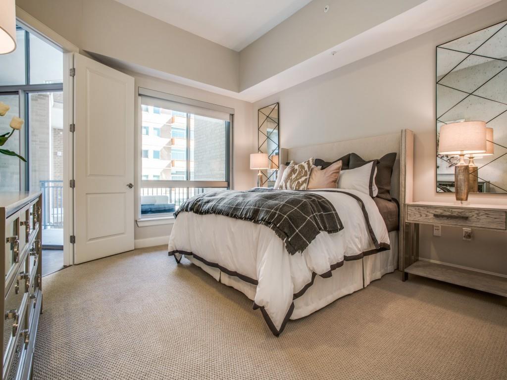 4719 Cole Avenue, Unit 358 Dallas, TX 75205 - Photo 11 of 35 a spacious bedroom with a bed and a window