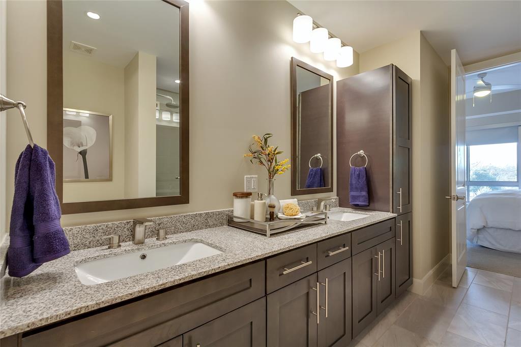4719 Cole Avenue, Unit 358 Dallas, TX 75205 - Photo 13 of 35 a bathroom with a granite countertop double vanity sink and a mirror