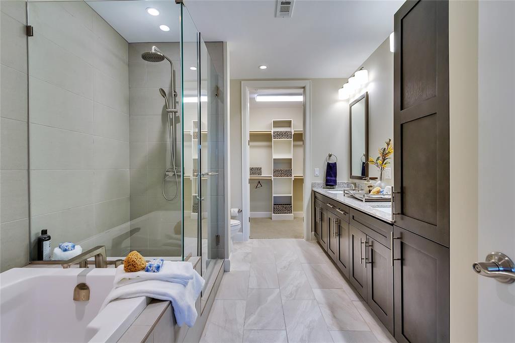 4719 Cole Avenue, Unit 358 Dallas, TX 75205 - Photo 14 of 35 a bathroom with a sink mirror and a bathtub