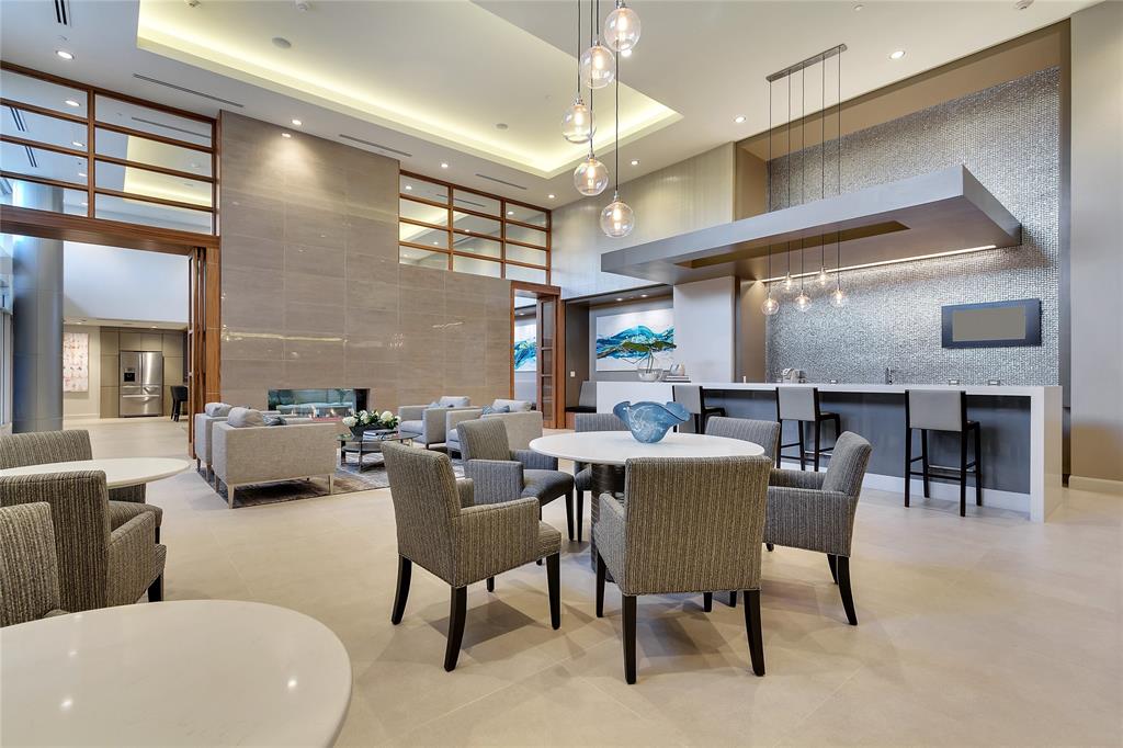 4719 Cole Avenue, Unit 358 Dallas, TX 75205 - Photo 19 of 35 a dining room with furniture and a chandelier