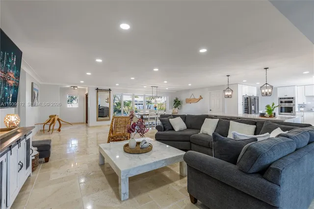 a room with furniture pool table tennis table and a rug
