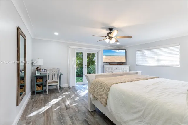 a bedroom with a bed and a night stand