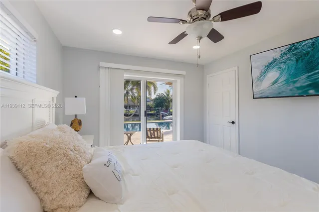 a front view of a house with a yard table and chairs