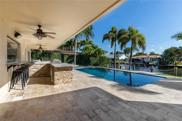 a front view of a house with a yard table and chairs