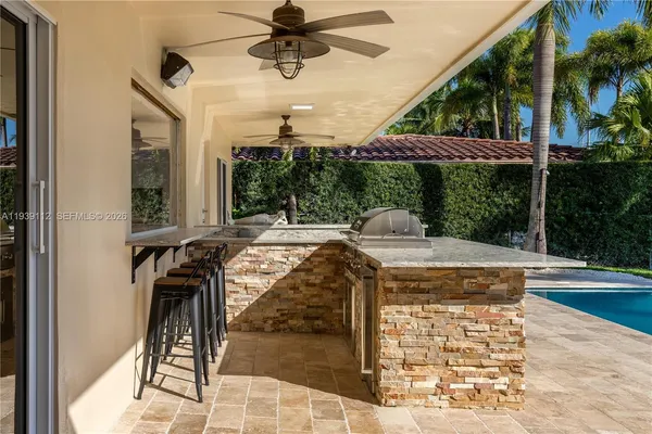 a swimming pool with outdoor seating and yard