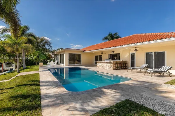a view of a swimming pool with a patio