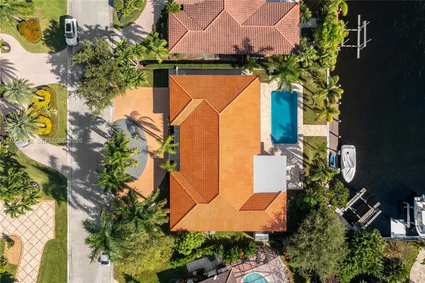 an aerial view of a house with a swimming pool