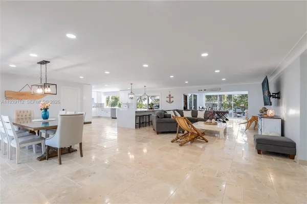 a view of a dining room with furniture window and outside view