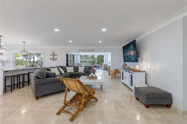 a large kitchen with stainless steel appliances cabinets a sink and a counter top space