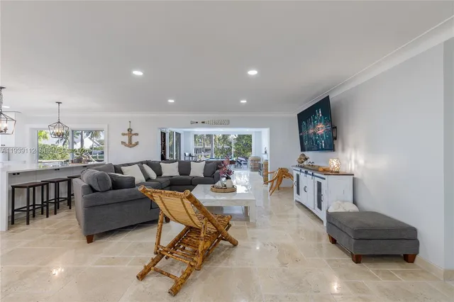 a large kitchen with stainless steel appliances cabinets a sink and a counter top space