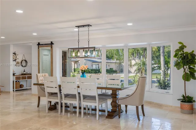 a kitchen with stainless steel appliances a stove a sink and a refrigerator