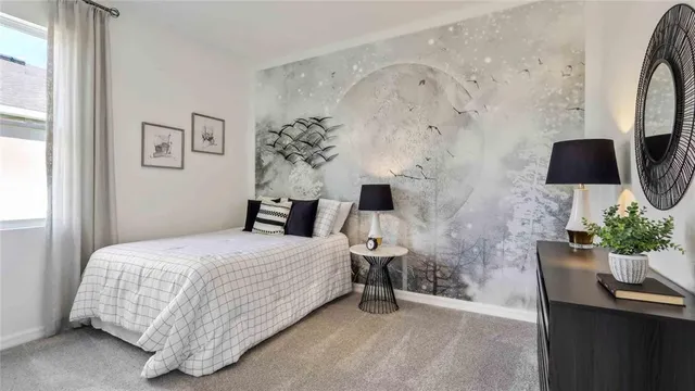 a bedroom with a bed and a potted plant