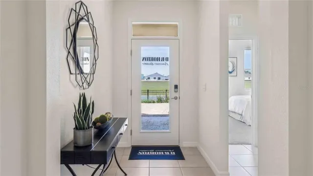 a view of hall way with mirror