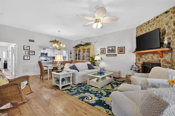 a living room with furniture fireplace and a flat screen tv
