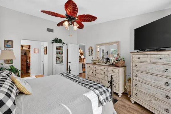 a en suite bathroom with double vanity sinks a large mirror and a shower