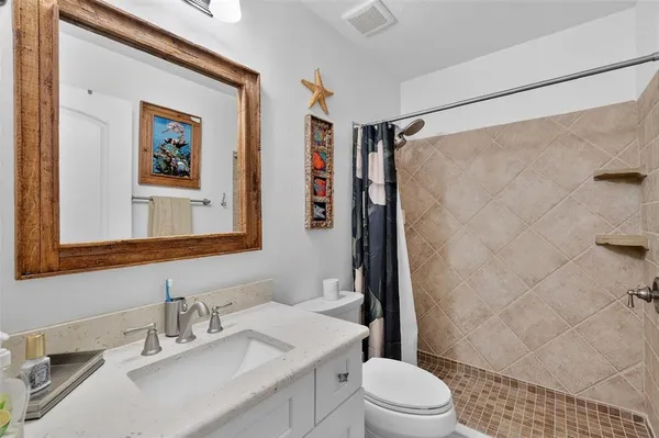 a work room with furniture and a potted plant