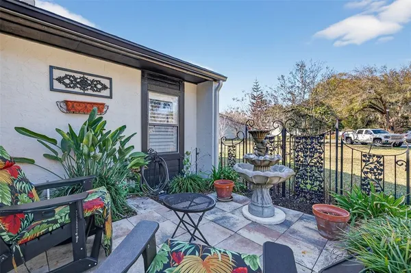 a view of a chairs and table in a backyard