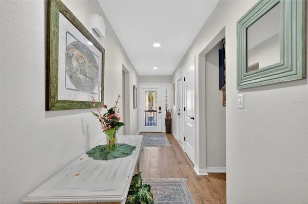 a hall way with furniture and a entryway