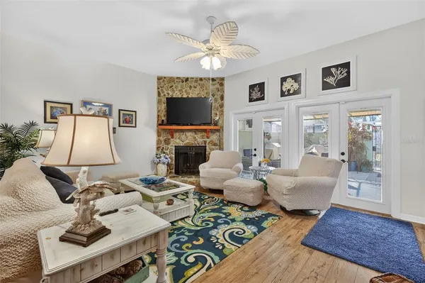 a living room with fireplace furniture and a flat screen tv