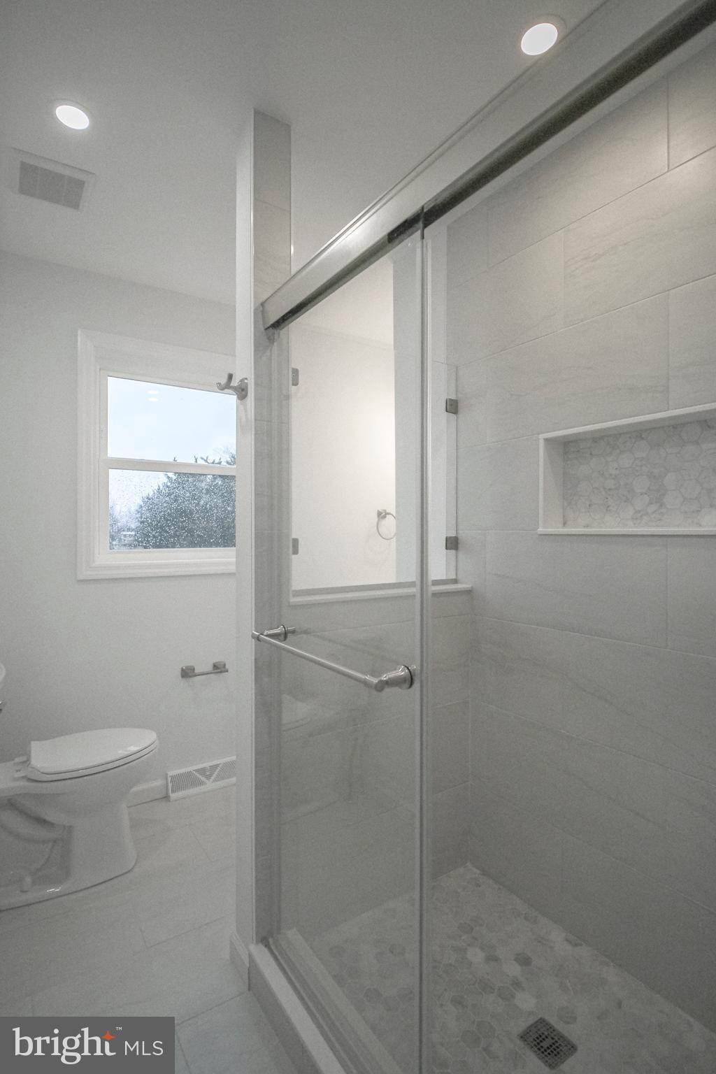 125 North Shore Road Marmora, NJ 08223 - Photo 15 of 27 a bathroom with a shower and toilet