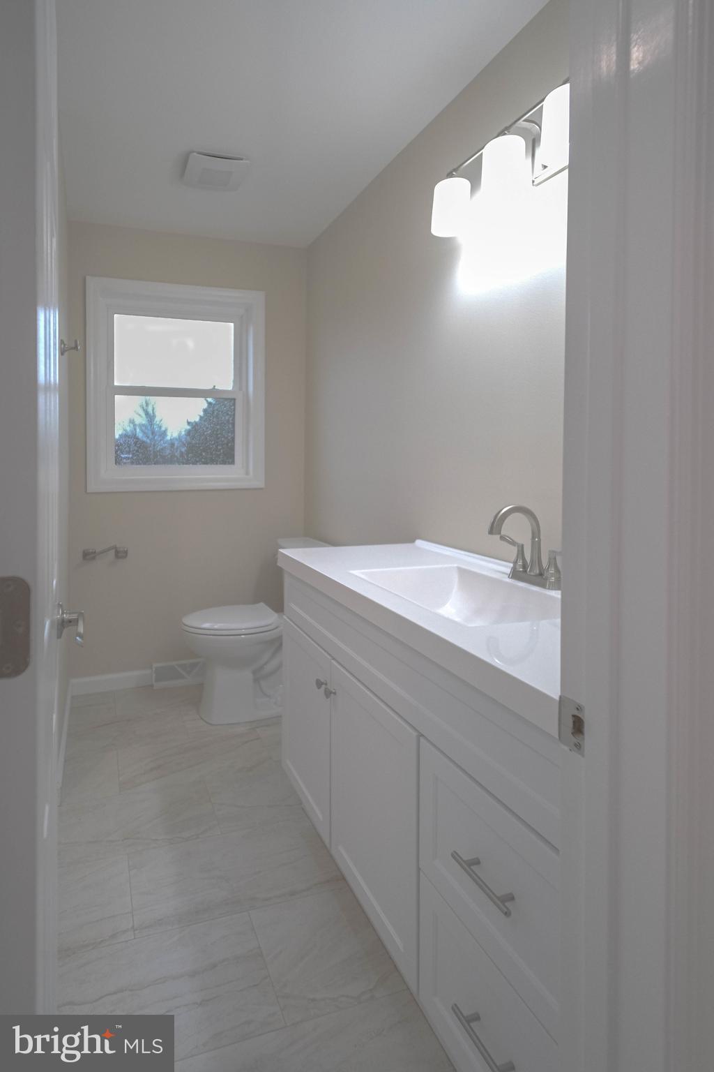125 North Shore Road Marmora, NJ 08223 - Photo 19 of 27 a bathroom with a sink a toilet and a mirror