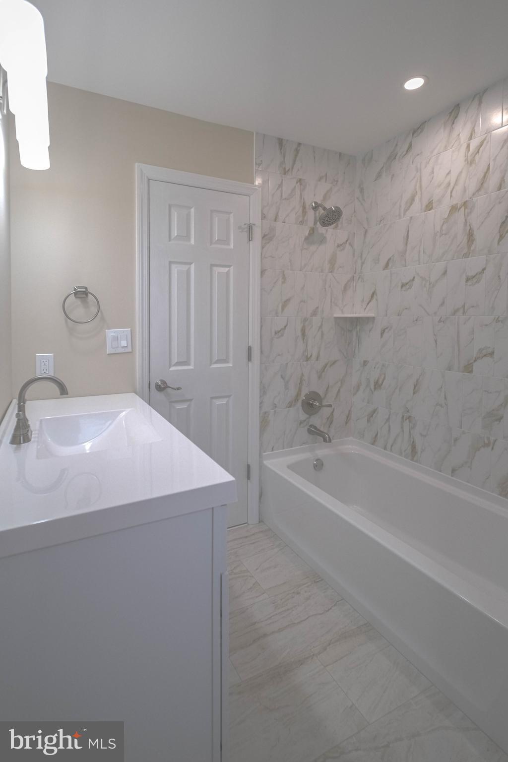 125 North Shore Road Marmora, NJ 08223 - Photo 20 of 27 a bathroom with a bathtub and a sink