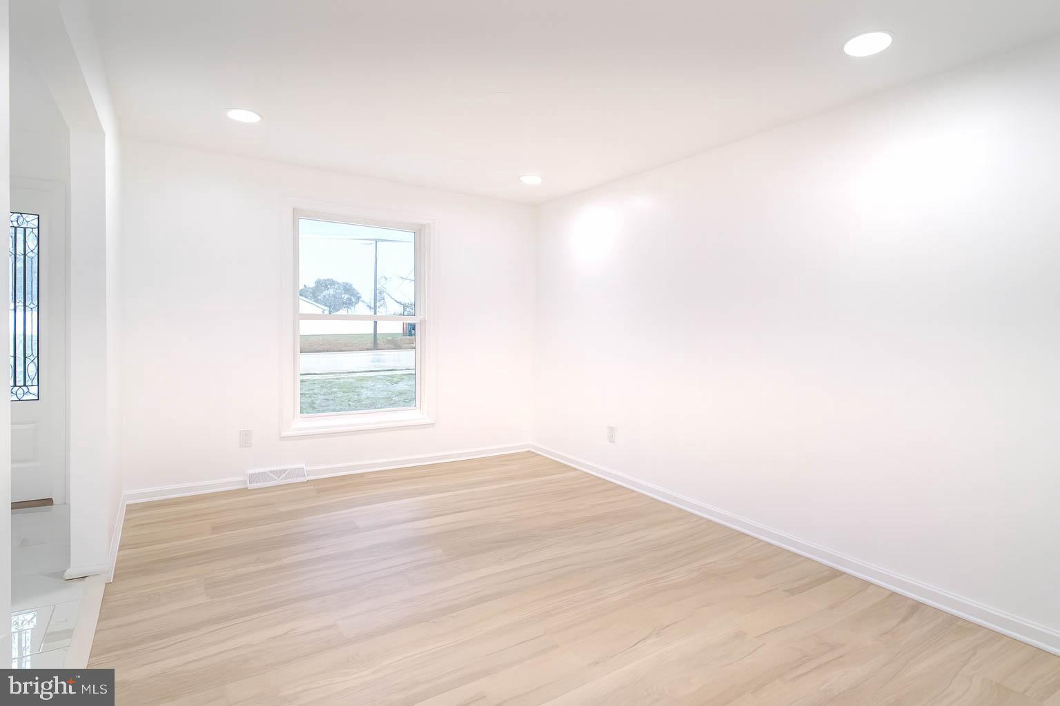 125 North Shore Road Marmora, NJ 08223 - Photo 8 of 27 a view of empty room with wooden floor and fan