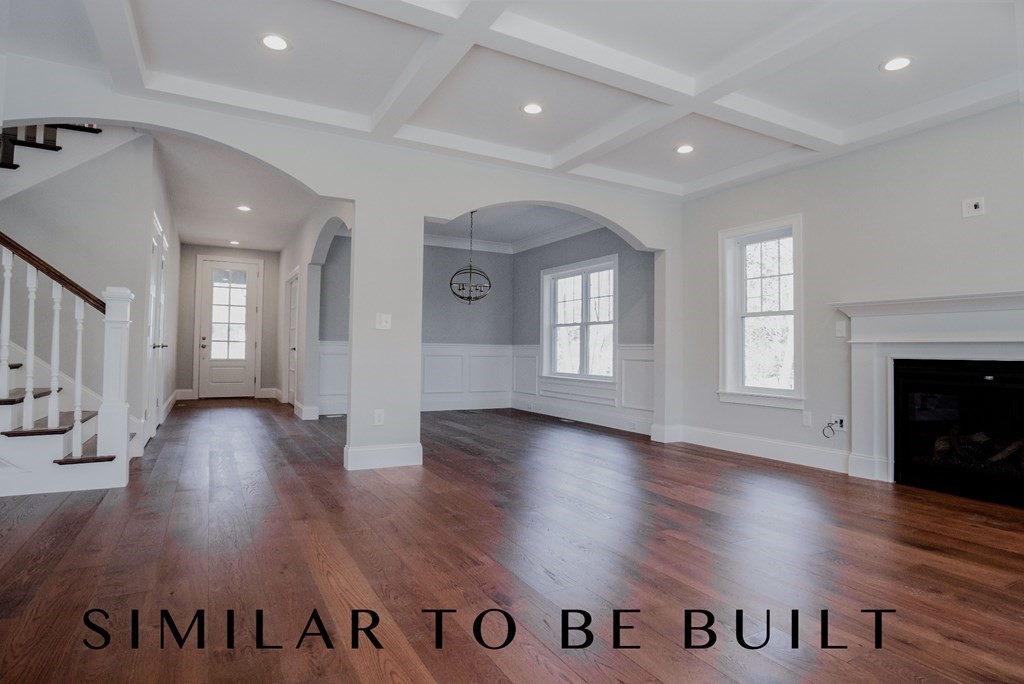 36 Wellesley Road Natick, MA 01760 - Photo 4 of 6 a view of an empty room with window and wooden floor