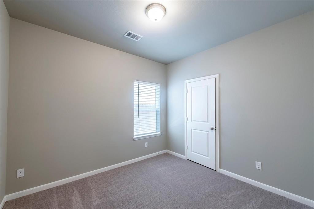 2069 Hartley Drive Forney, TX 75126 - Photo 13 of 27 an empty room with windows