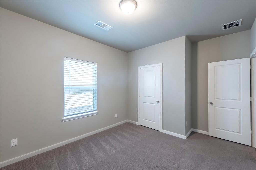 2069 Hartley Drive Forney, TX 75126 - Photo 14 of 27 an empty room with windows