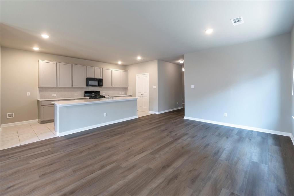 2069 Hartley Drive Forney, TX 75126 - Photo 3 of 27 a view of kitchen with wooden floor